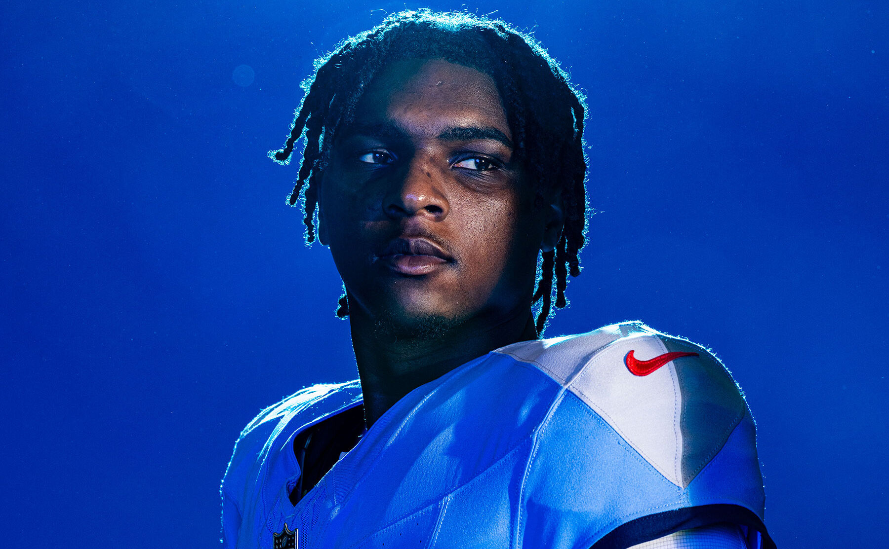 Cam Ward holding a football on the August, 28, 2025 Cover of the Nashville Scene